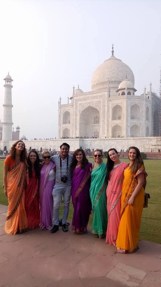 Guests in saris at the Taj Mahal